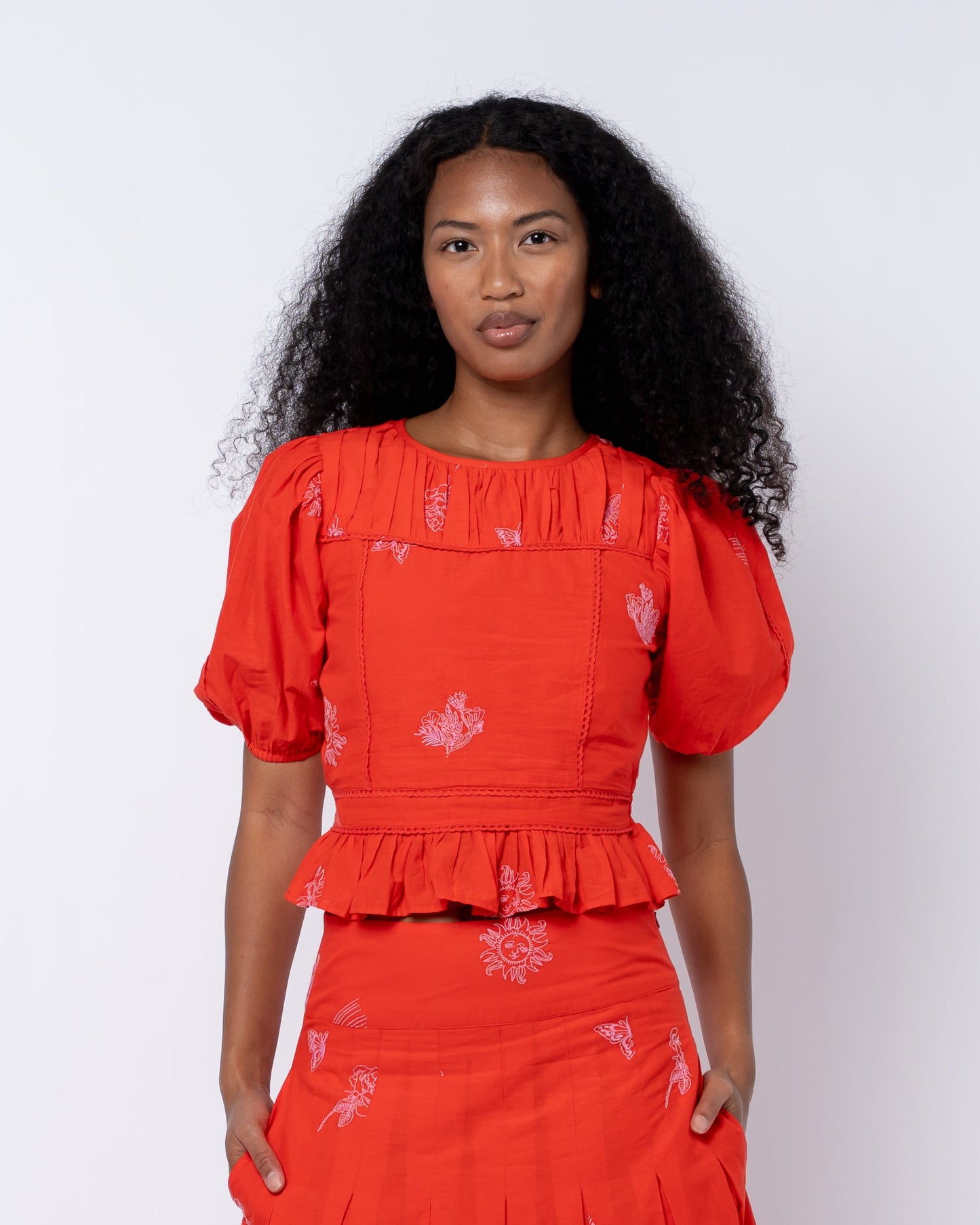 Allisa Embroidered Shirred Peplum Top