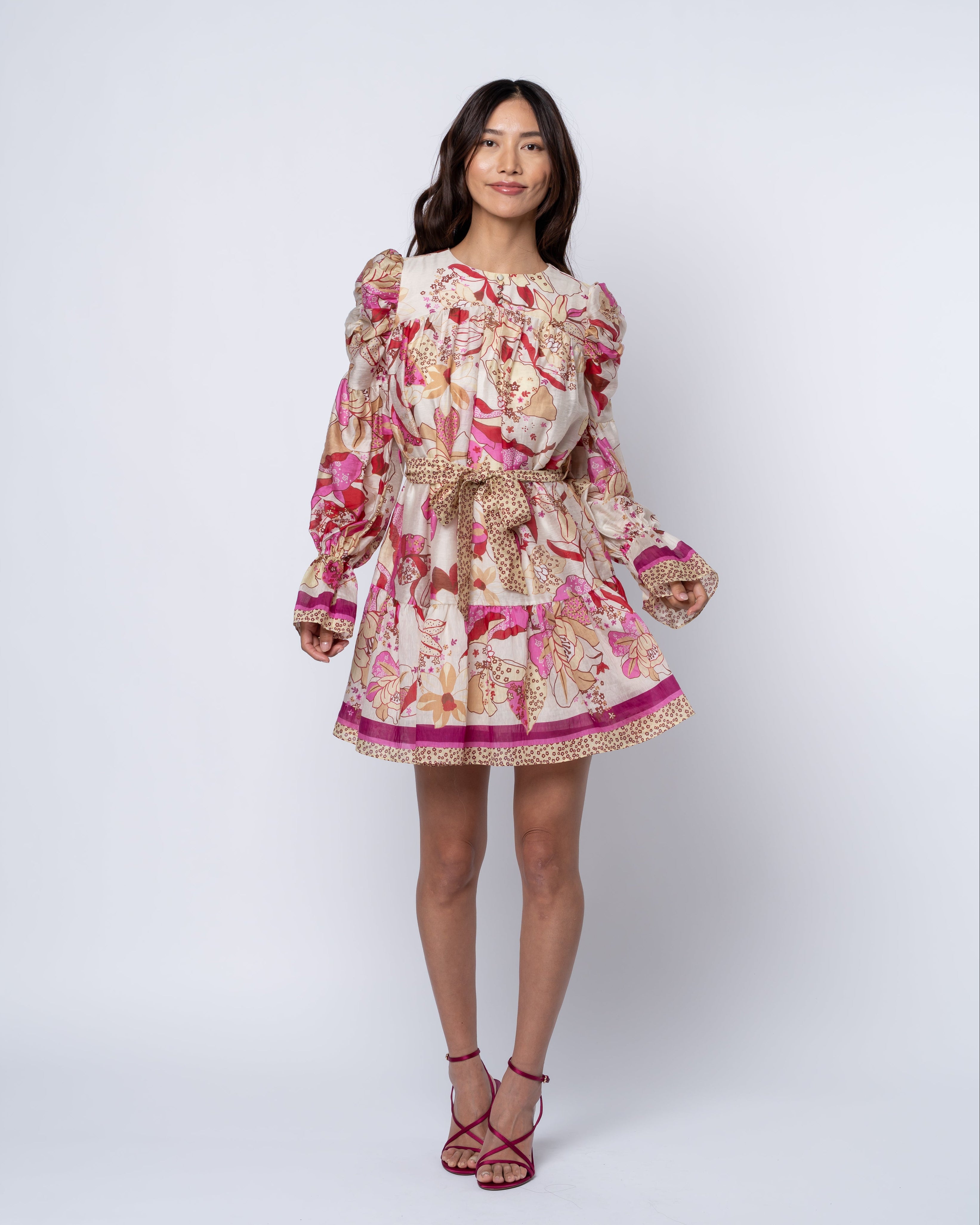 Woman wearing a floral dress on a white background