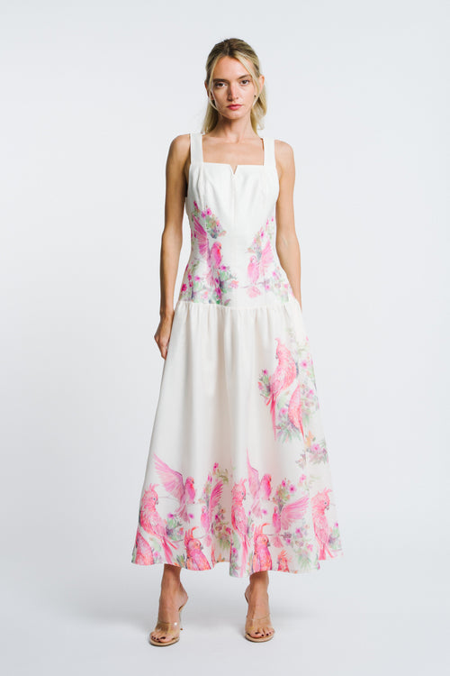 Load image 1 in gallery view. Woman wearing a white dress with pink floral pattern on a white background
