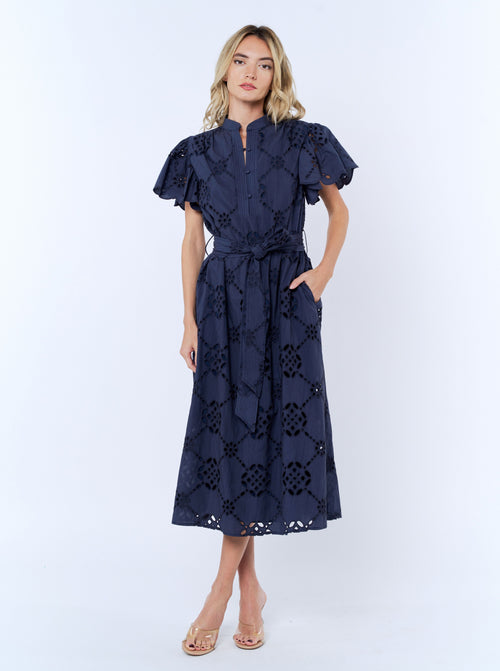 Load image 1 in gallery view. Woman wearing a navy lace dress on a white background