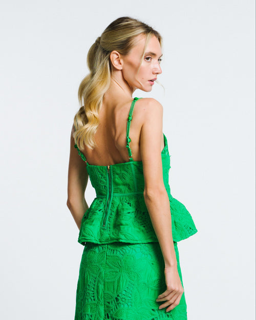 Load image 1 in gallery view. Woman wearing a green lace dress on a white background