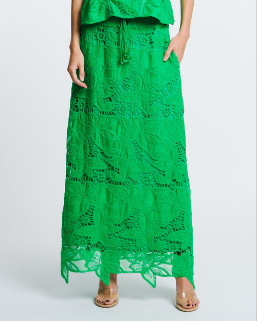 Load image 1 in gallery view. Woman wearing a green lace dress on a white background