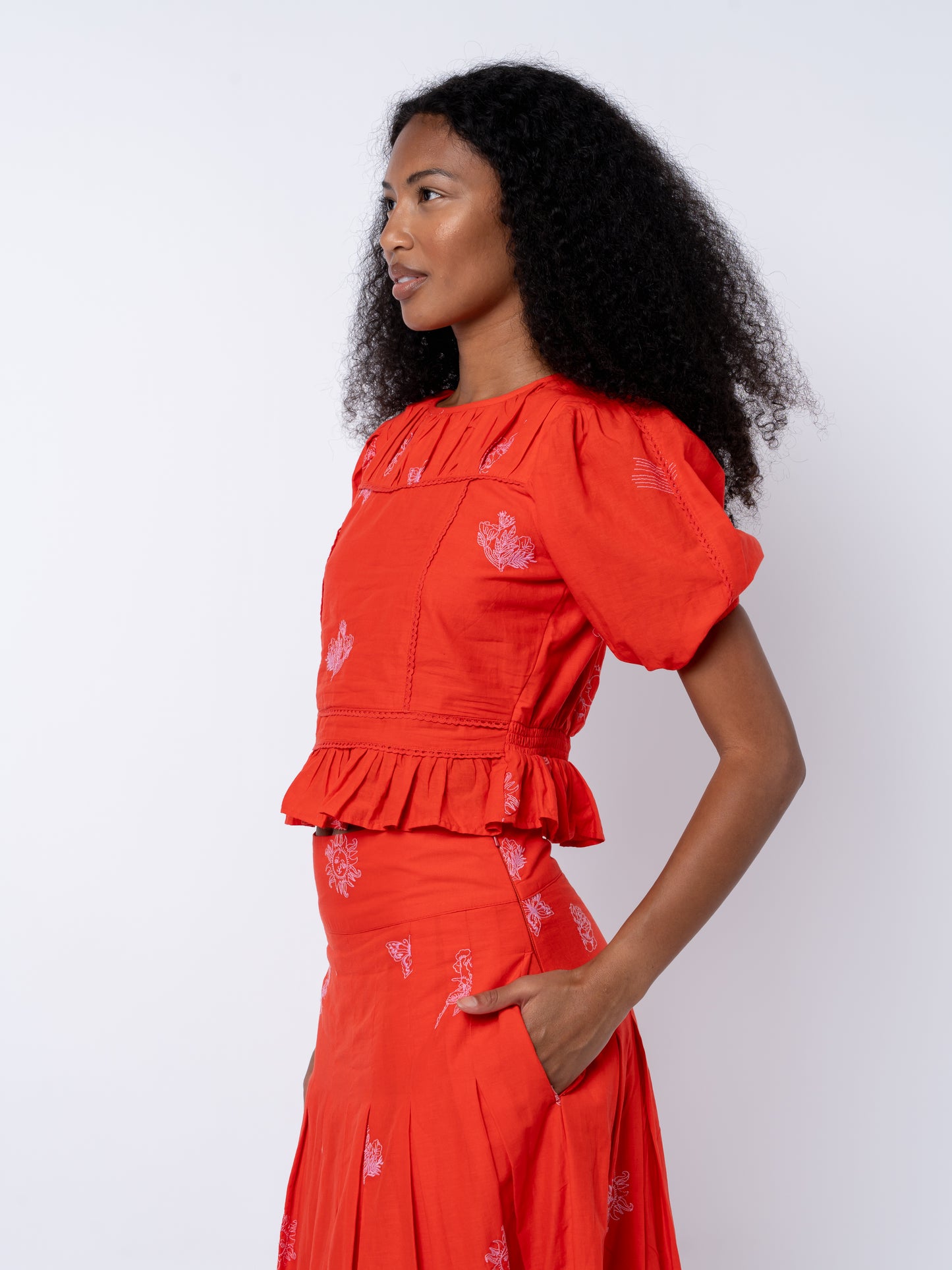 Allisa Embroidered Shirred Peplum Top