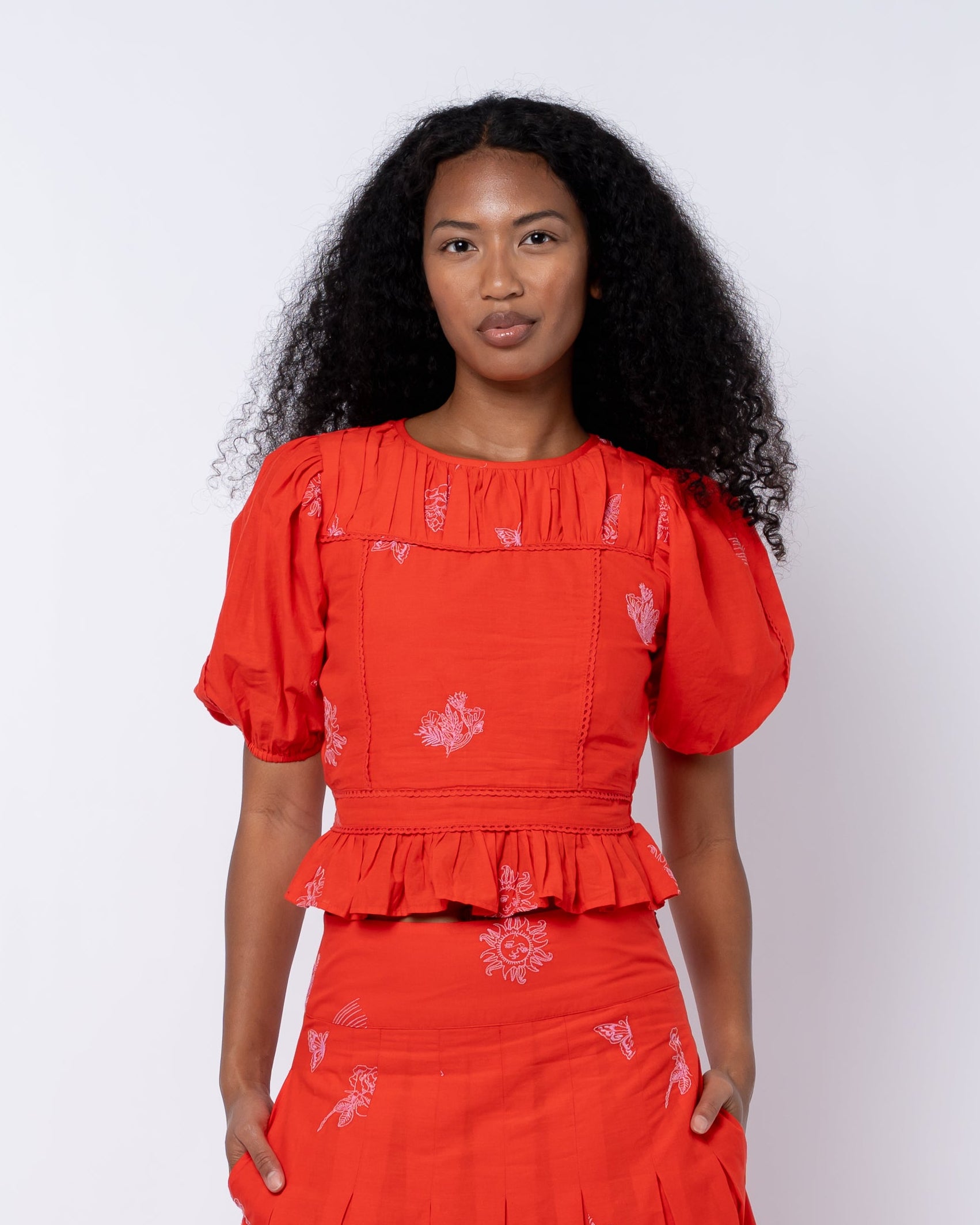 Allisa Embroidered Shirred Peplum Top