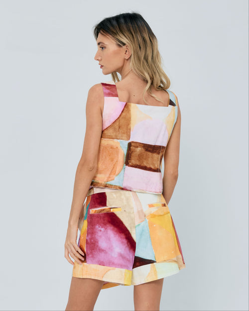 Load image 1 in gallery view. Woman wearing a colorful one-shoulder dress against a white background