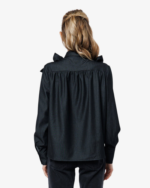 Load image 1 in gallery view. Person wearing a black outfit with a high collar on a white background