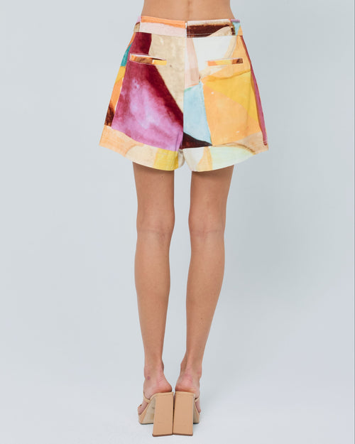 Load image 1 in gallery view. Woman wearing a colorful outfit with a white background